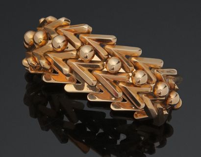 null Bracelet articulé en or jaune 750 millièmes, les maillons à décor de chevrons...