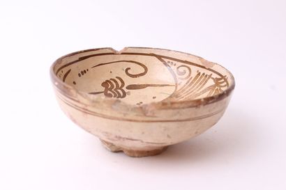 null Terracotta bowl with red glossy decoration on a buff background of stylized...