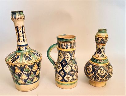 null FEZ 

Set of two vases and a pitcher in polychrome earthenware with stylized...