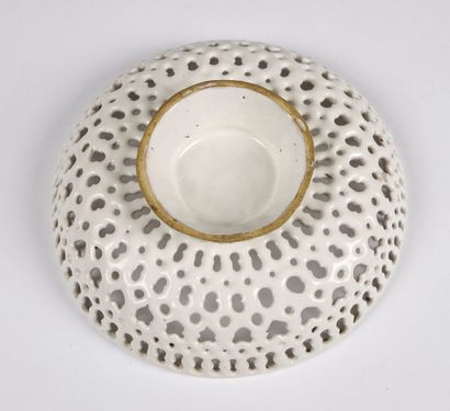 null FAENZA

Circular openwork bowl on pedestal in white enamelled earthenware with...