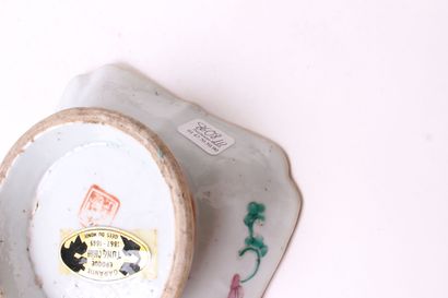 null CHINA 


Porcelain square pocket on a round base decorated with characters and...