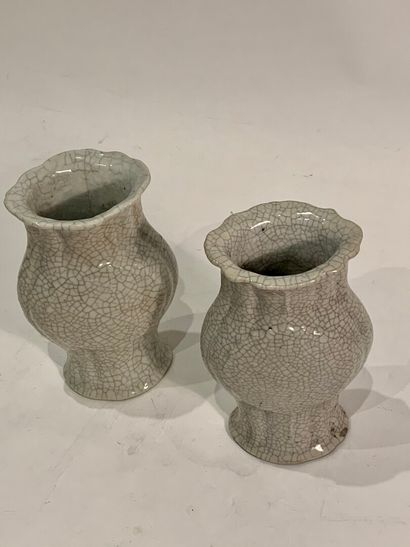 null CHINA


Pair of ribbed baluster vases in porcelain with a cracked celadon background.


19th...