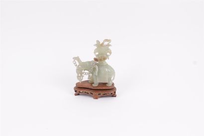 CHINA


Green hardstone figurine representing...
