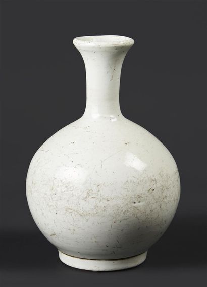 KOREA 


White porcelain bottle vase of ovoid...
