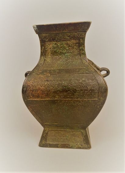 CHINA 


Bronze vase with two handles decorated...