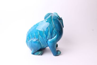 null CHINA 


Noh dog sitting on his hind legs in turquoise blue glazed ceramic....
