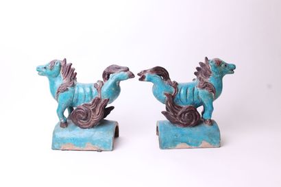 null 
CHINA






Pair of turquoise and eggplant glazed ceramic roof tiles decorated...