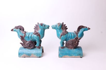 null 
CHINA






Pair of turquoise and eggplant glazed ceramic roof tiles decorated...