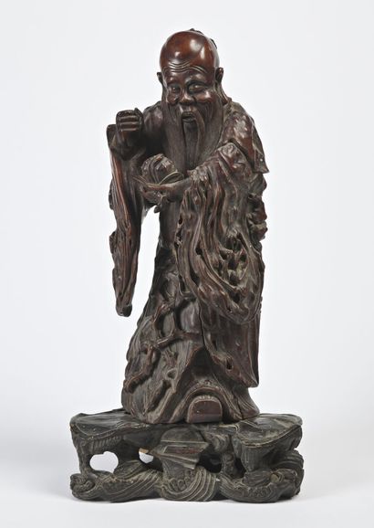 null CHINA - 19th century


Statuette of immortal in carved root, standing holding...