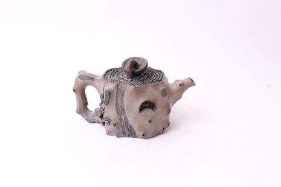 null 
CHINA 






Ceramic jug in the shape of a trunk, the handle decorated with...