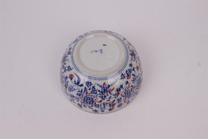 null CHINA


Porcelain bowl decorated with blue and red flowers.


Bears a mark under...