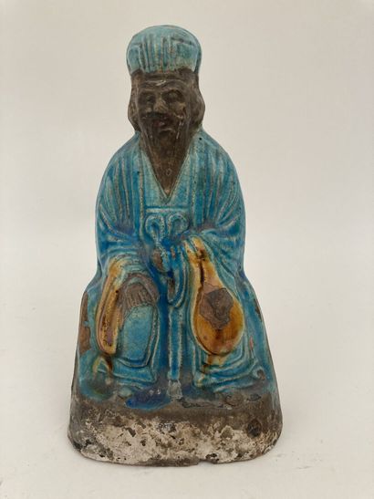 null CHINA 


Stoneware subject partially glazed turquoise and yellow representing...