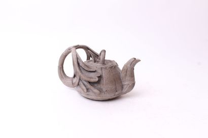 null 
CHINA






Ceramic jug, the handle in the shape of a flower. Bears a stamp...