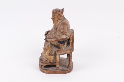 null CHINA, 19th century 


Seated subject in partially polychrome carved wood. 


Height:...