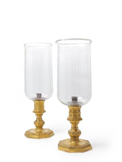 null Pair of ormolu and molded glass candlesticks, the octagonal shaft with compartments...