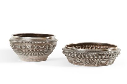 null CAMBODIA, early 20th century 

Two large silver cups with chased and embossed...