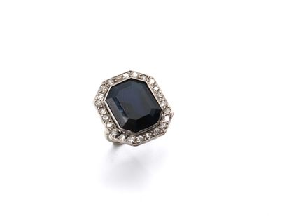 null Ring in white gold 750 thousandths adorned in the center of a rectangular sapphire...