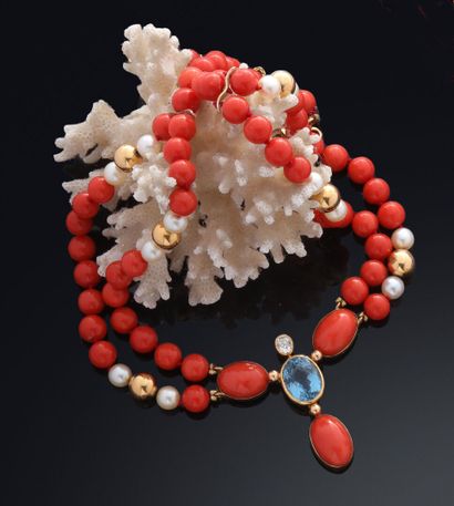 Necklace of coral balls alternated with small...