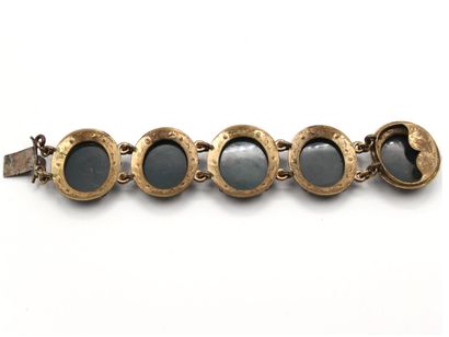 null Metal bracelet composed of five links of oval shape, each decorated with a plate...