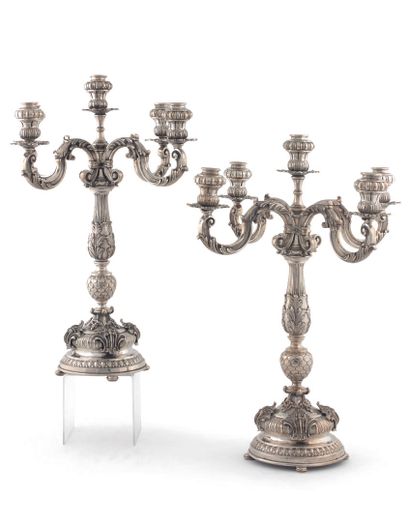 null Pair of candelabras with five lights in silver 800 thousandths posing on a round...