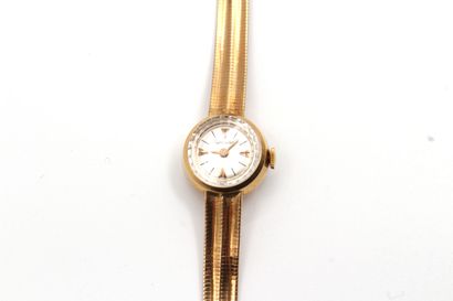 null Watch bracelet of lady in yellow gold 750 thousandths, the watch of round form,...