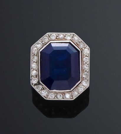 null Ring in white gold 750 thousandths adorned in the center of a rectangular sapphire...