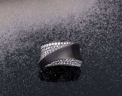 null Ring in white gold 750 thousandths plain and brushed black rhodium, the center...