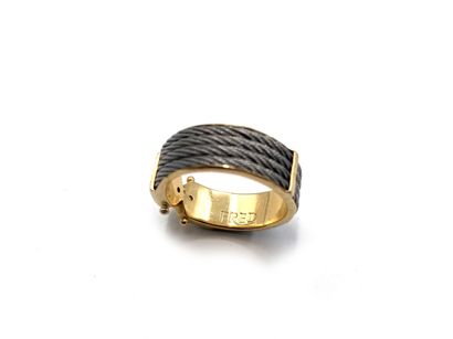 null Ring in yellow gold 750 thousandths and metal decorated with four rows of cables,...