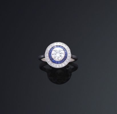 null Ring in white gold 750 thousandths decorated with a round diamond of brilliant...