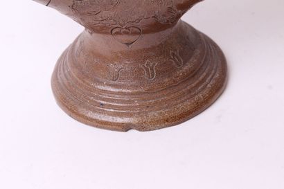 null Ringed goblet on foot out of salted brown stoneware with engraved decoration...