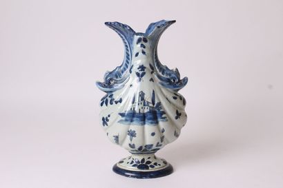 null ITALY

Vase of baluster form with flat body godronnée out of earthenware provided...