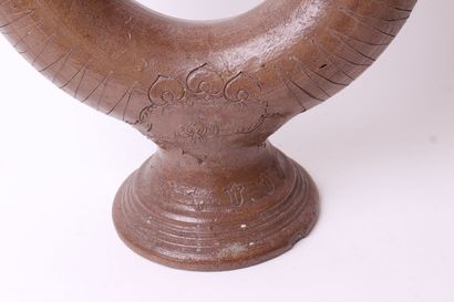 null Ringed goblet on foot out of salted brown stoneware with engraved decoration...