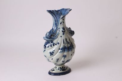 null ITALY

Vase of baluster form with flat body godronnée out of earthenware provided...