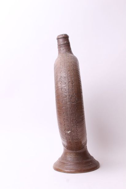 null Ringed goblet on foot out of salted brown stoneware with engraved decoration...