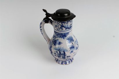 null GERMANY 

Earthenware pitcher covered and mounted with blue monochrome decoration...
