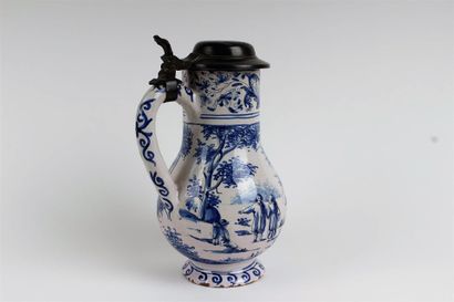 null GERMANY 

Earthenware pitcher covered and mounted with blue monochrome decoration...