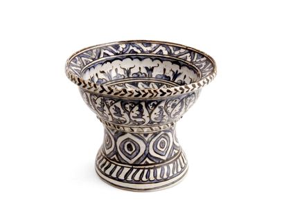 null TURKEY

Earthenware cup on foot with decoration in blue and black of foliage...