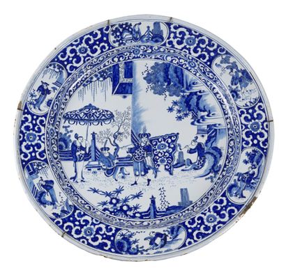 null NEVERS 

Large round earthenware dish decorated in blue monochrome in the center...