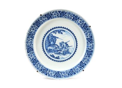 null MOUSTIERS

Round earthenware dish decorated in blue monochrome of a scene of...