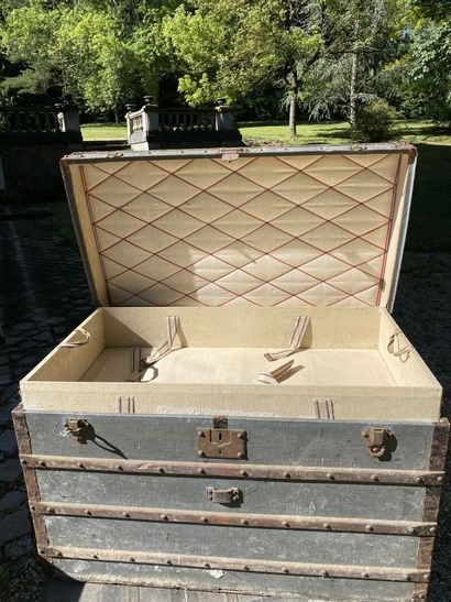 null SEVEN WOODEN TRAVEL TRUNKS covered with fabric, leather and metal, including...