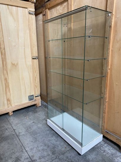 null TWO VITRINES with five shelves, glazed on all sides, opening with two sliding...