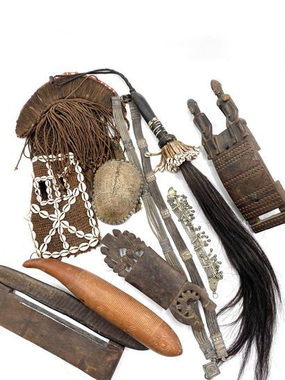 null AFRICA

Set of ritual objects made of wood, shells, and crains including a headdress,...