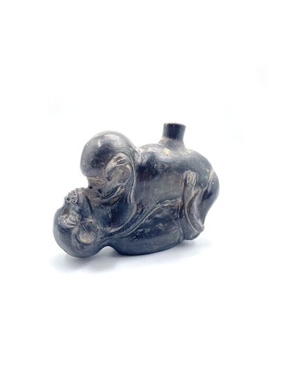 null Black patinated terracotta flask decorated with two monkeys one on top of the...