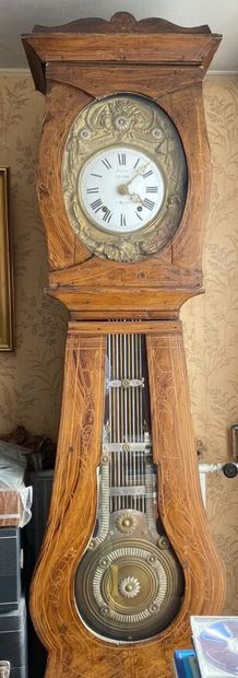 null CLOCK COMTOISE in natural wood, the movement in gilded brass decorated with...