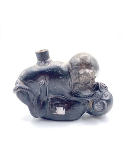null Black patinated terracotta flask decorated with two monkeys one on top of the...