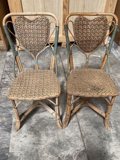 null Set of two mismatched garden chairs in wood and polychrome wicker, the back...