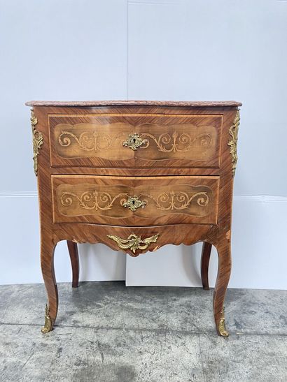 null WOODEN COMMODE opening with two drawers and resting on cambered feet. Red marble...