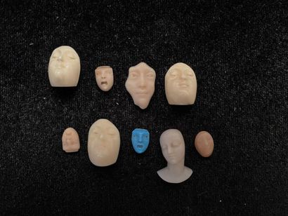 null Set of miniature heads in hard stone.