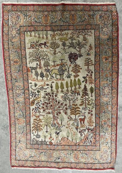 null Silk carpet, one decorated with a central medallion and floral scrolls on a...