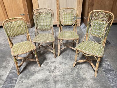 null Set of four mismatched garden chairs in wood and polychrome woven wicker. 

20th...